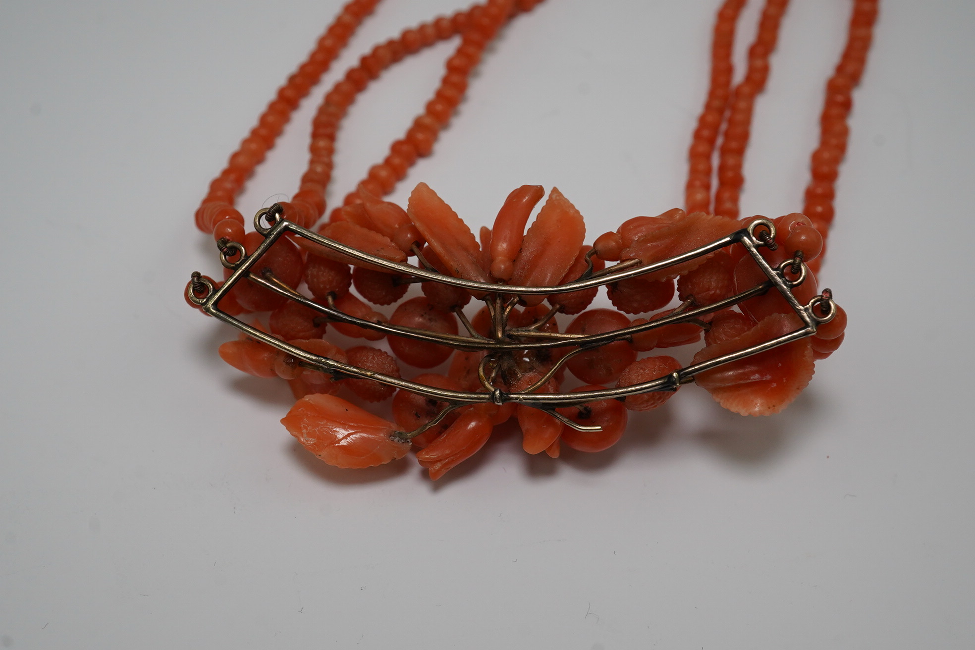 A late Victorian triple strand coral bead necklace